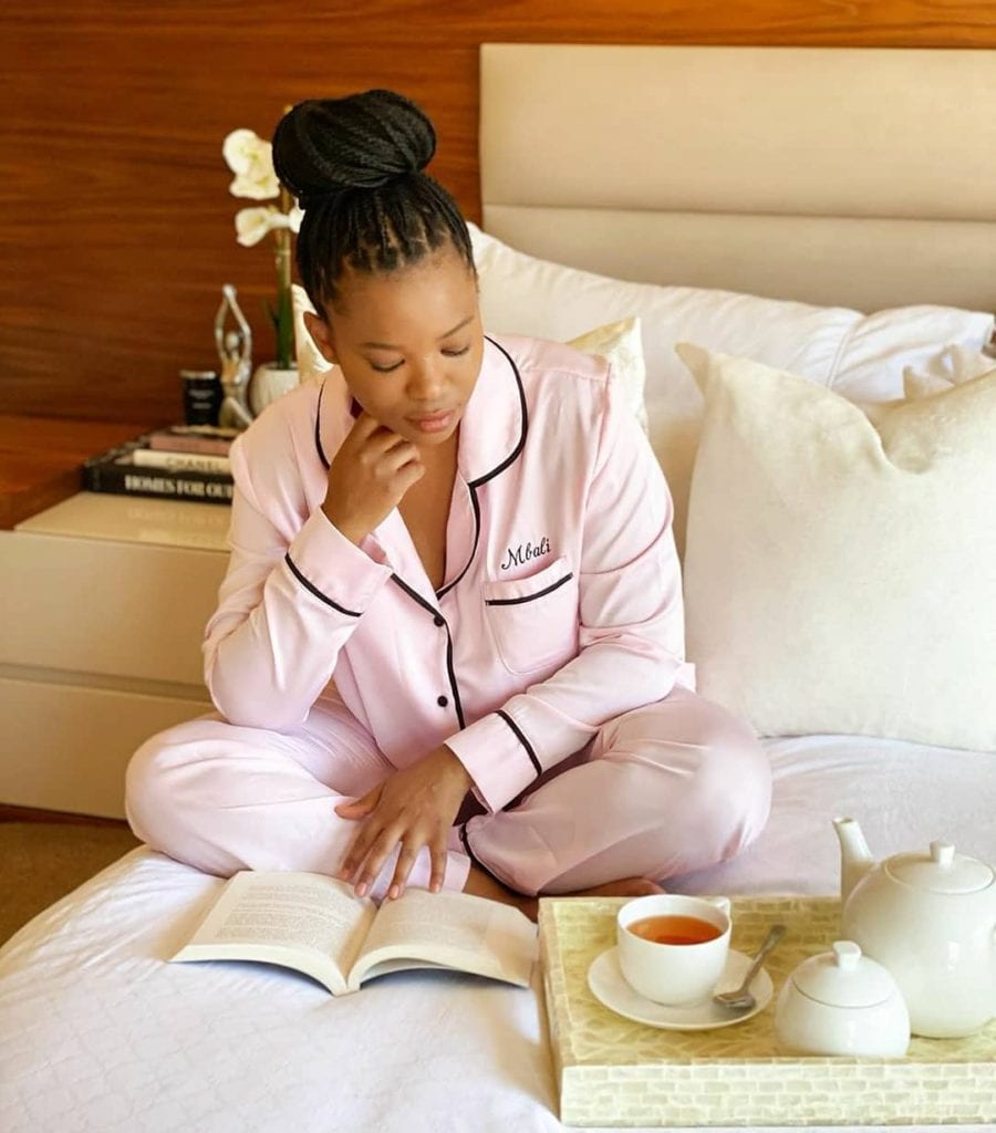 woman in bed reading
